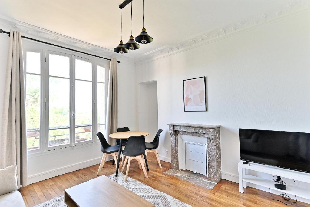 TV a/nebo společenská místnost v ubytování Appartement Spacieux et paisible Magnifique Vue