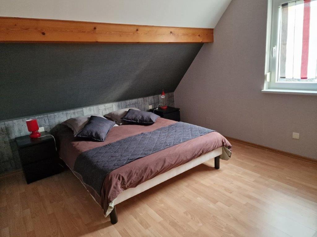 Una cama o camas en una habitación de Gîte Alsace en vue