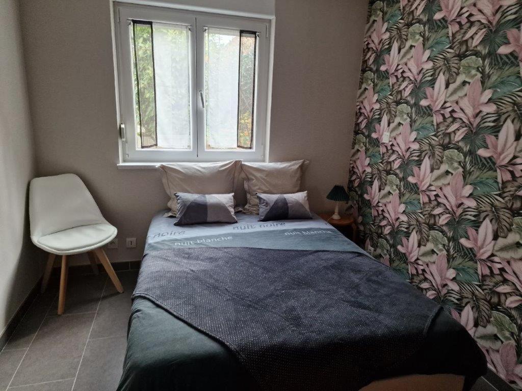 Una cama o camas en una habitación de Gîte Alsace en vue