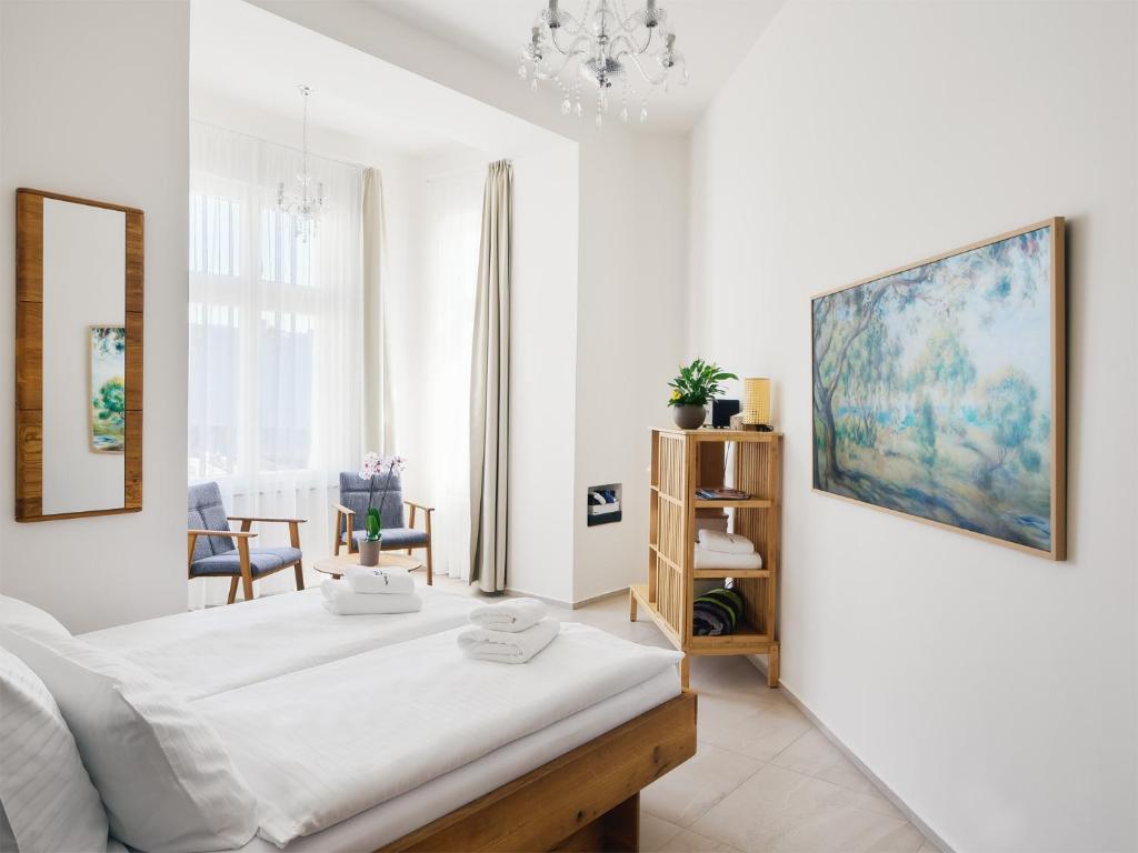 Postel nebo postele na pokoji v ubytování IMPERIAL Apartments