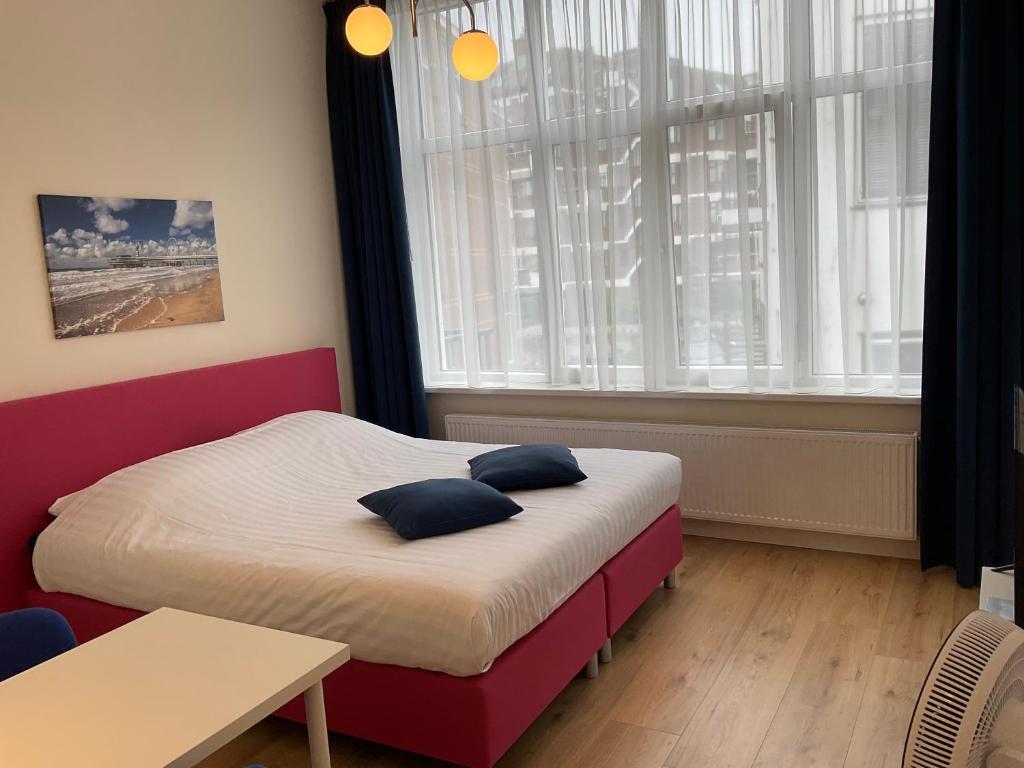 Ein Bett oder Betten in einem Zimmer der Unterkunft Aristoteles Apartments