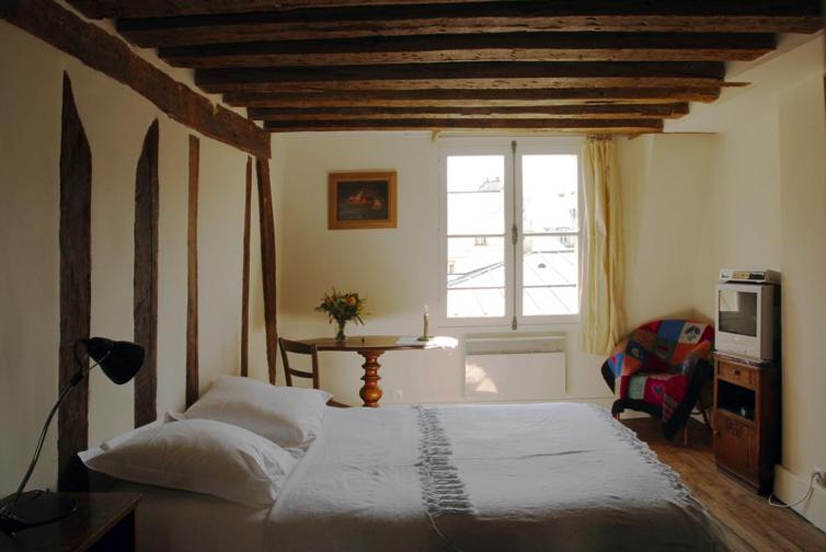 Ένα ή περισσότερα κρεβάτια σε δωμάτιο στο Nest in Paris