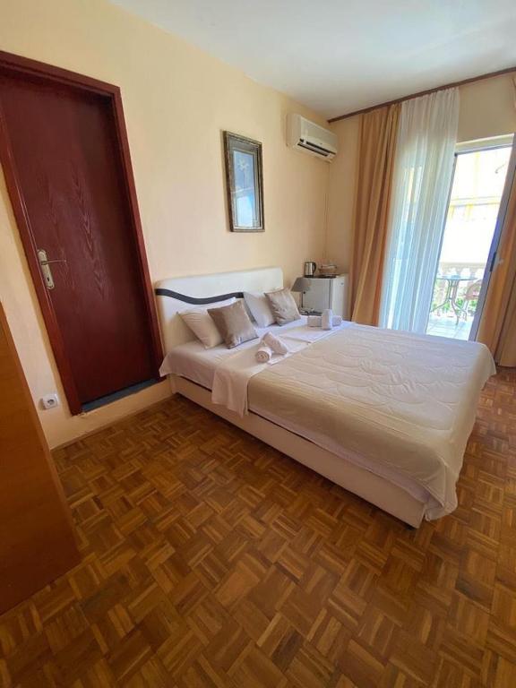 Postel nebo postele na pokoji v ubytování Apartments Dunja