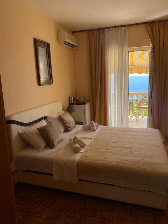 Postel nebo postele na pokoji v ubytování Apartments Dunja