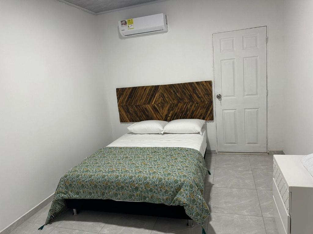 Postel nebo postele na pokoji v ubytování Hostal mayapo confort