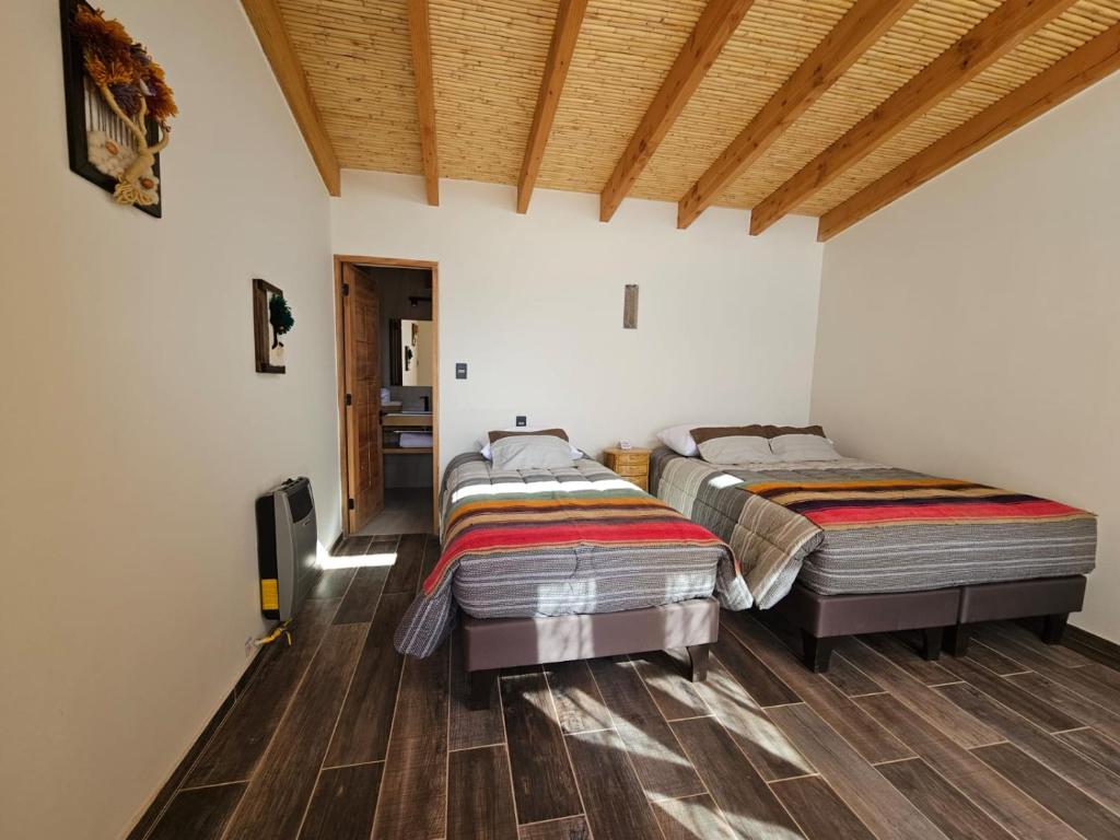 Postel nebo postele na pokoji v ubytování Hotel Pirwa