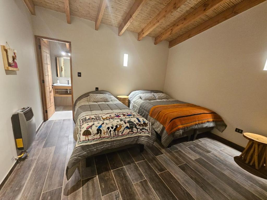 Postel nebo postele na pokoji v ubytování Hotel Pirwa