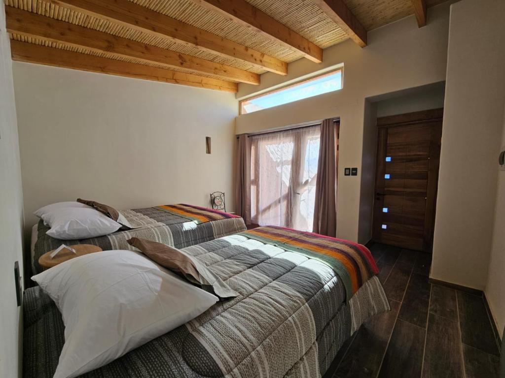 Postel nebo postele na pokoji v ubytování Hotel Pirwa