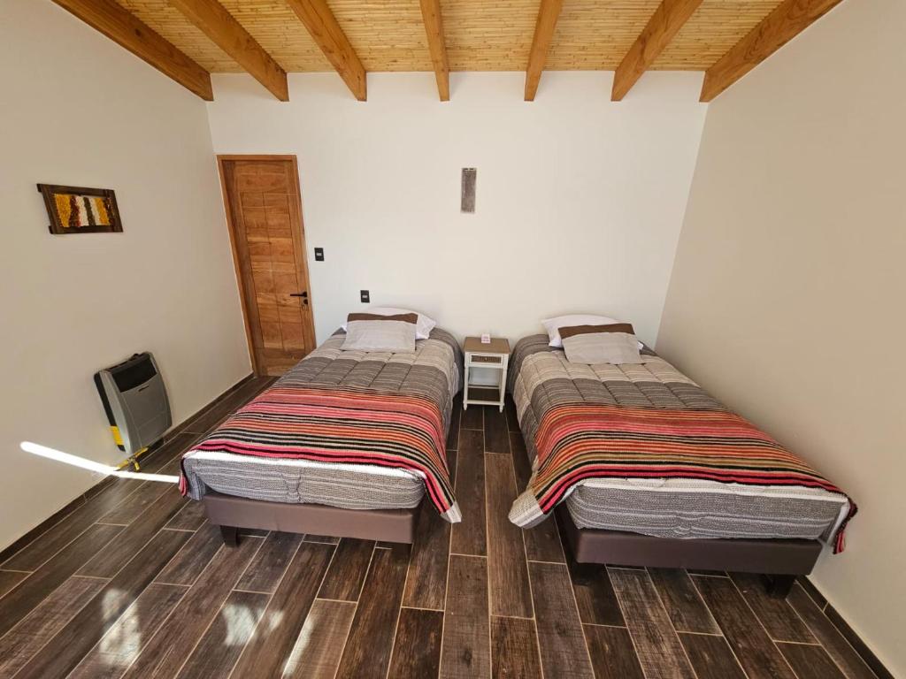 Postel nebo postele na pokoji v ubytování Hotel Pirwa