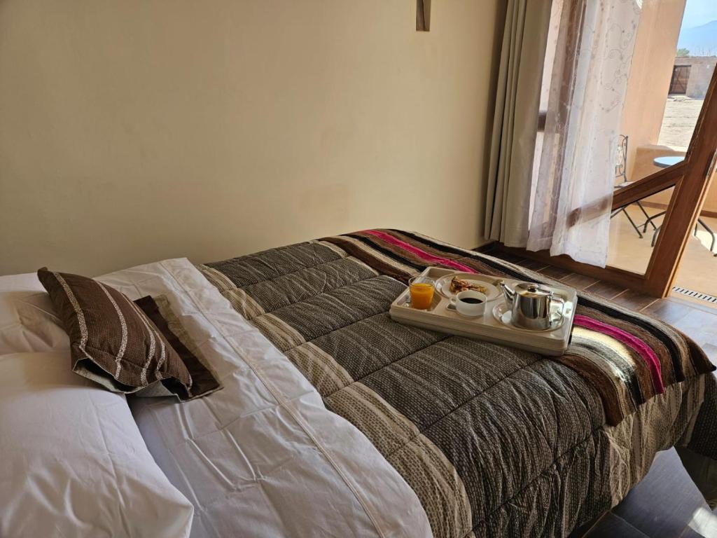 Postel nebo postele na pokoji v ubytování Hotel Pirwa