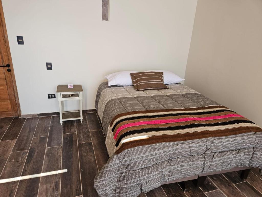 Postel nebo postele na pokoji v ubytování Hotel Pirwa
