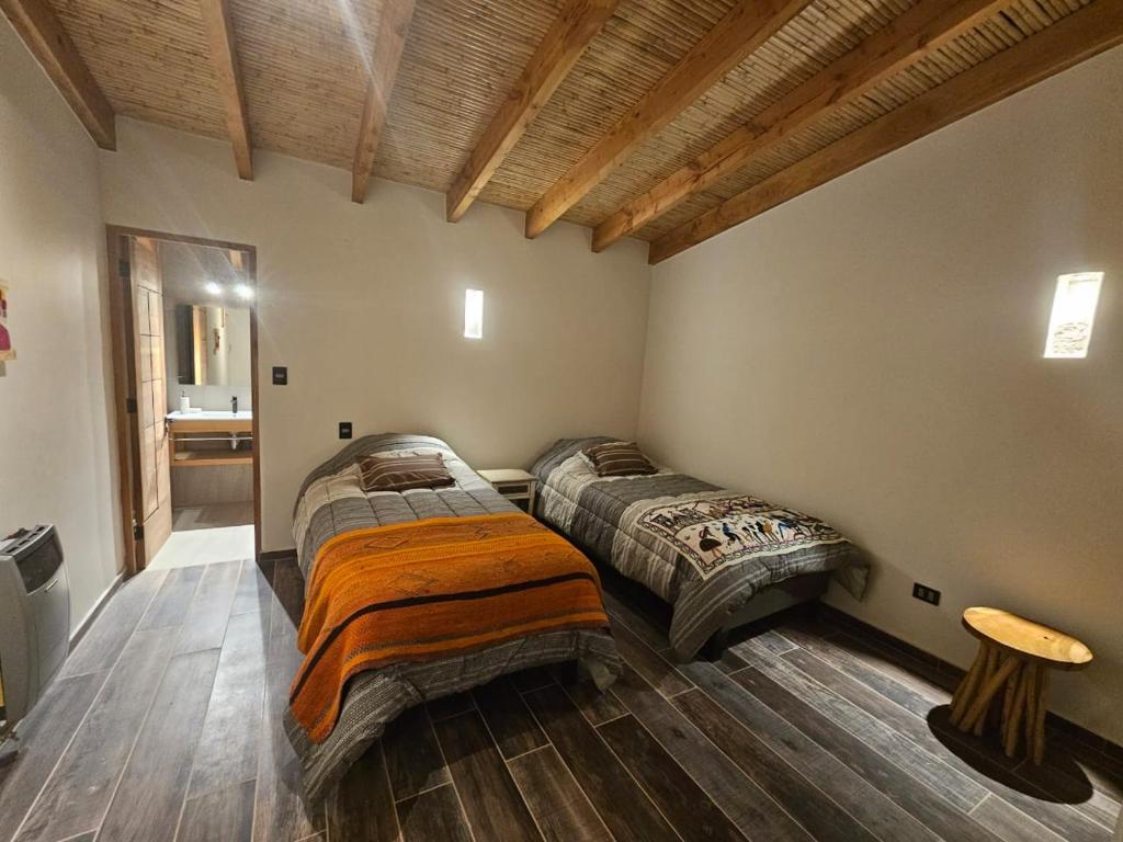 Postel nebo postele na pokoji v ubytování Hotel Pirwa