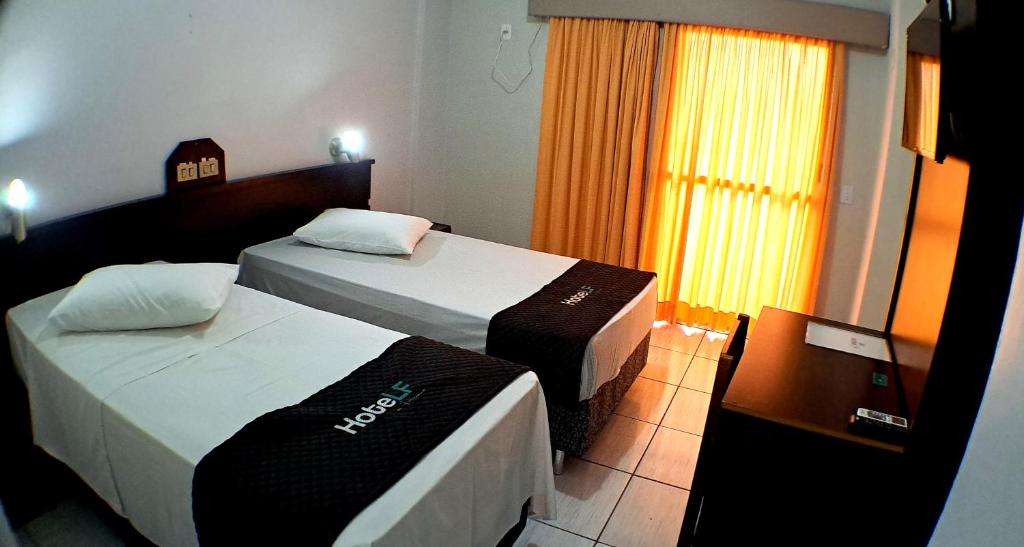 Postel nebo postele na pokoji v ubytování Hotel LF By Feliciano