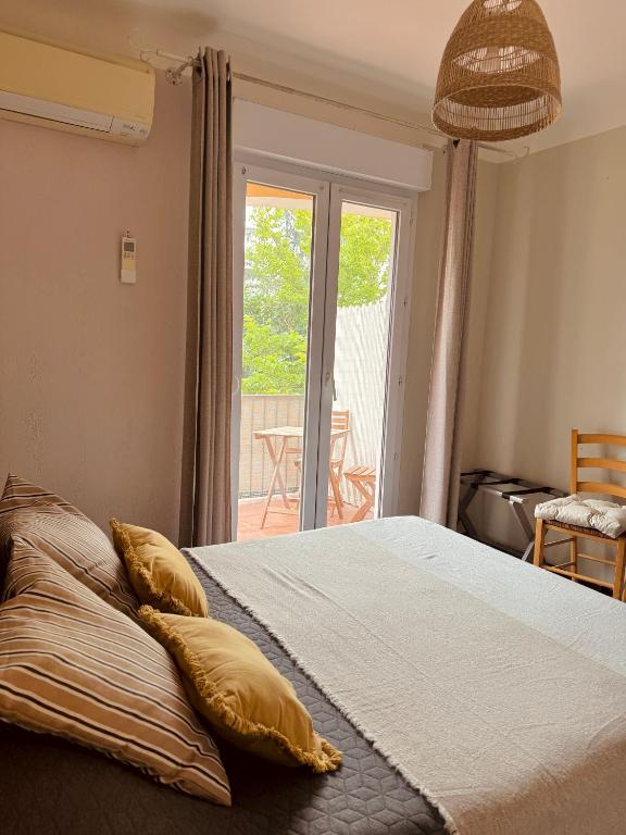 Postel nebo postele na pokoji v ubytování Hôtel le Nid