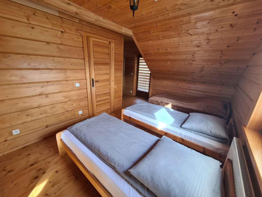Postel nebo postele na pokoji v ubytování Tęczowe Wzgórze
