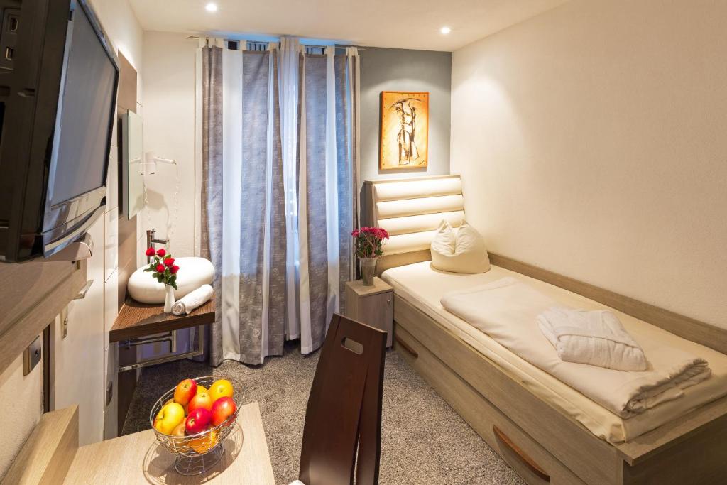 TV a/nebo společenská místnost v ubytování Bavaria Hotel Münchner Hof Superior