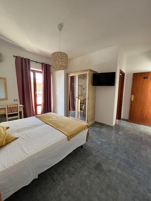 Postel nebo postele na pokoji v ubytování TC HOTEL