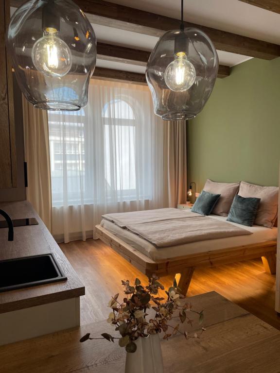Postel nebo postele na pokoji v ubytování Golden Key Apartments