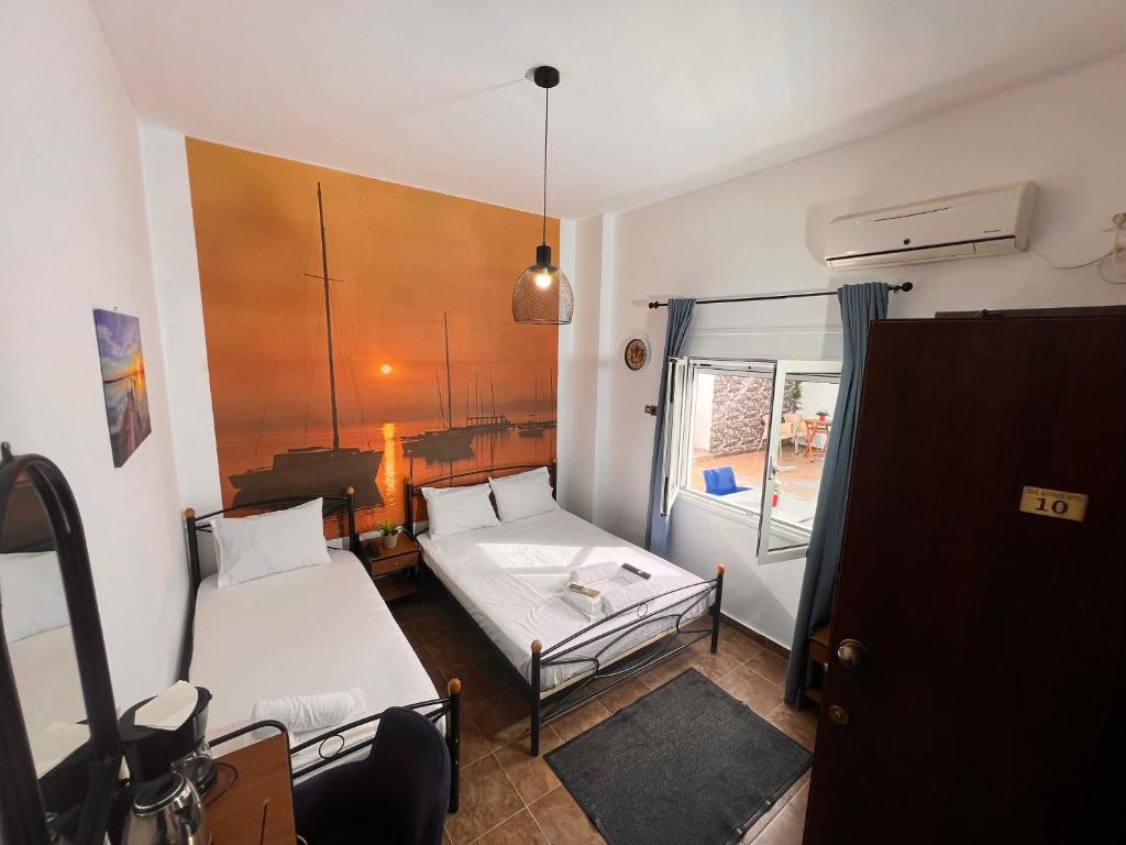 Postel nebo postele na pokoji v ubytování blue Hotel