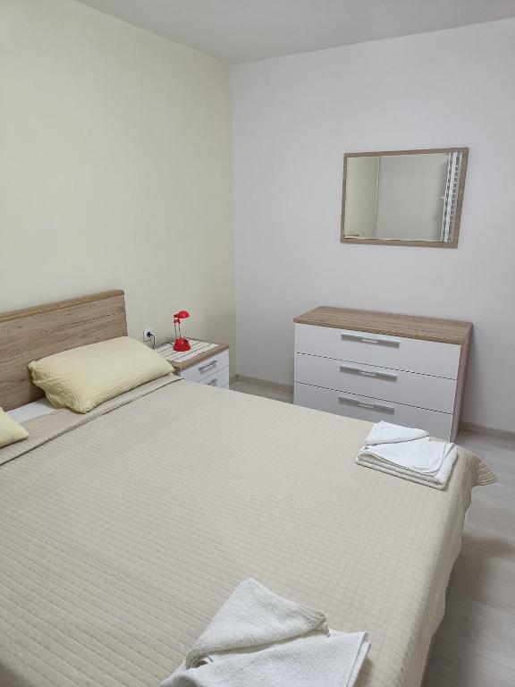 Postel nebo postele na pokoji v ubytování Apartments Vukas