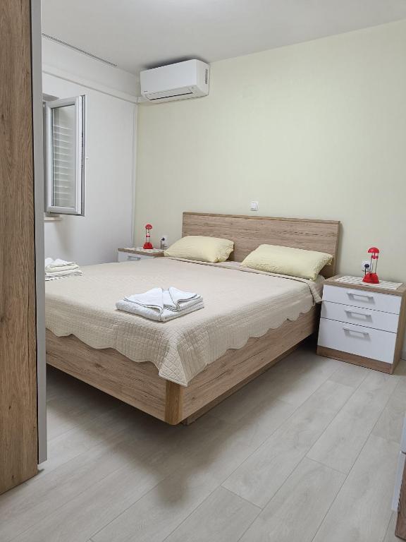 Postel nebo postele na pokoji v ubytování Apartments Vukas