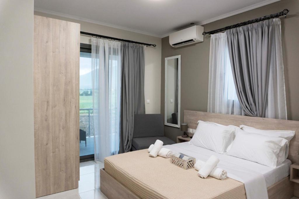 Postel nebo postele na pokoji v ubytování Zathay Apartments