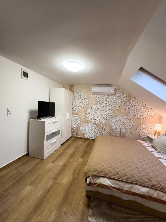 Postel nebo postele na pokoji v ubytování RP Apartmanház