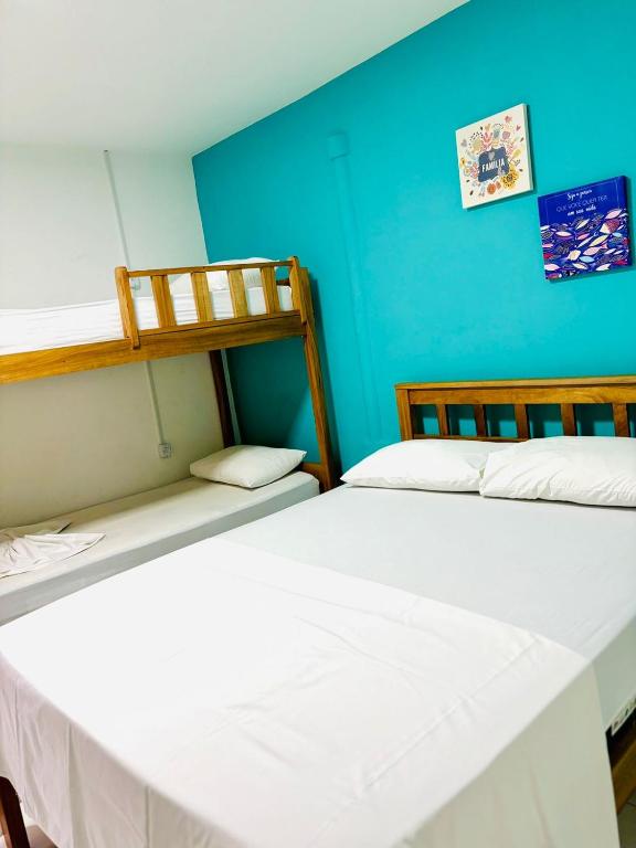 Postel nebo postele na pokoji v ubytování Hostel Recanto da Paciência