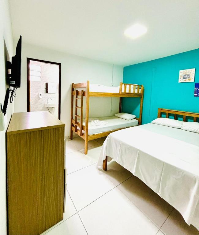 Postel nebo postele na pokoji v ubytování Hostel Recanto da Paciência