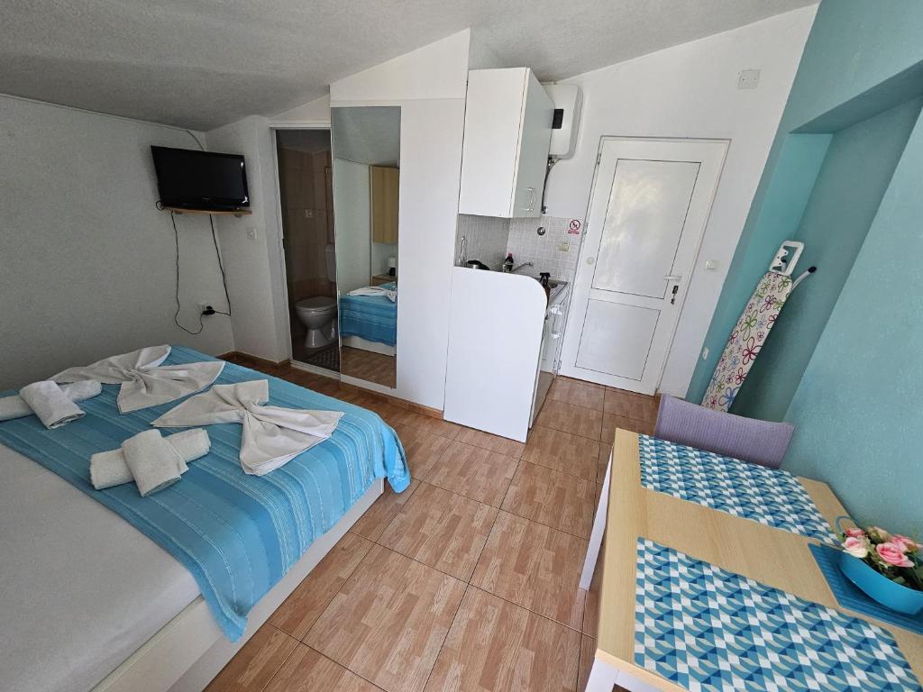 Postel nebo postele na pokoji v ubytování Apartments Mirjana