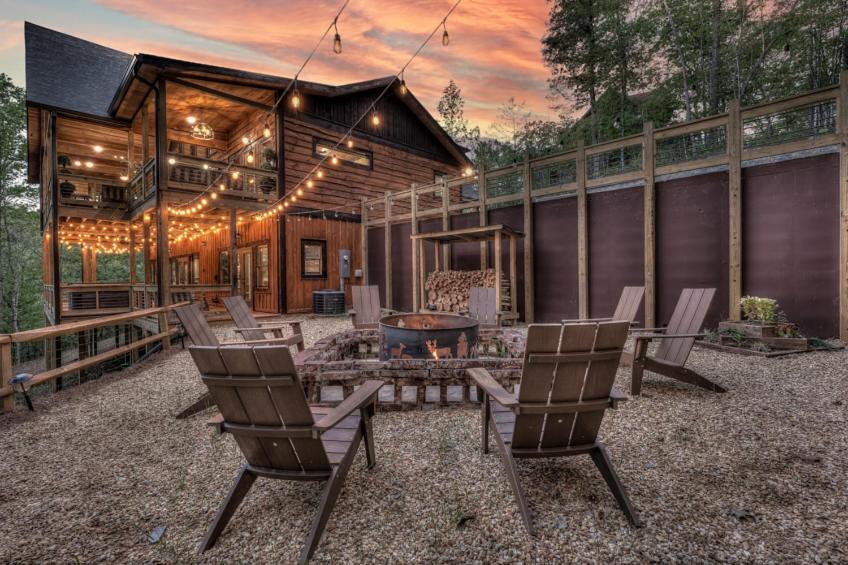 a house with a patio with chairs and a table at Friends in High Places in Blue Ridge