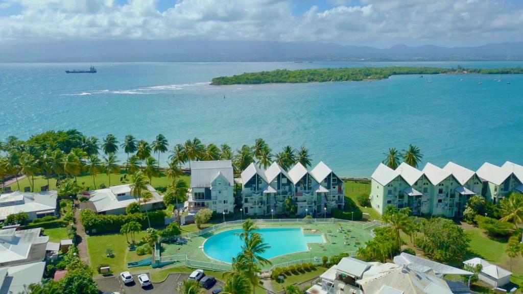 an aerial view of the resort and the ocean at Atoumo piscine citerne in Le Gosier