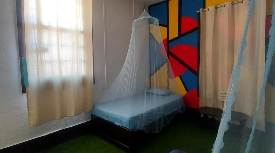 Postel nebo postele na pokoji v ubytování La Casona de Lobitos - Cowork