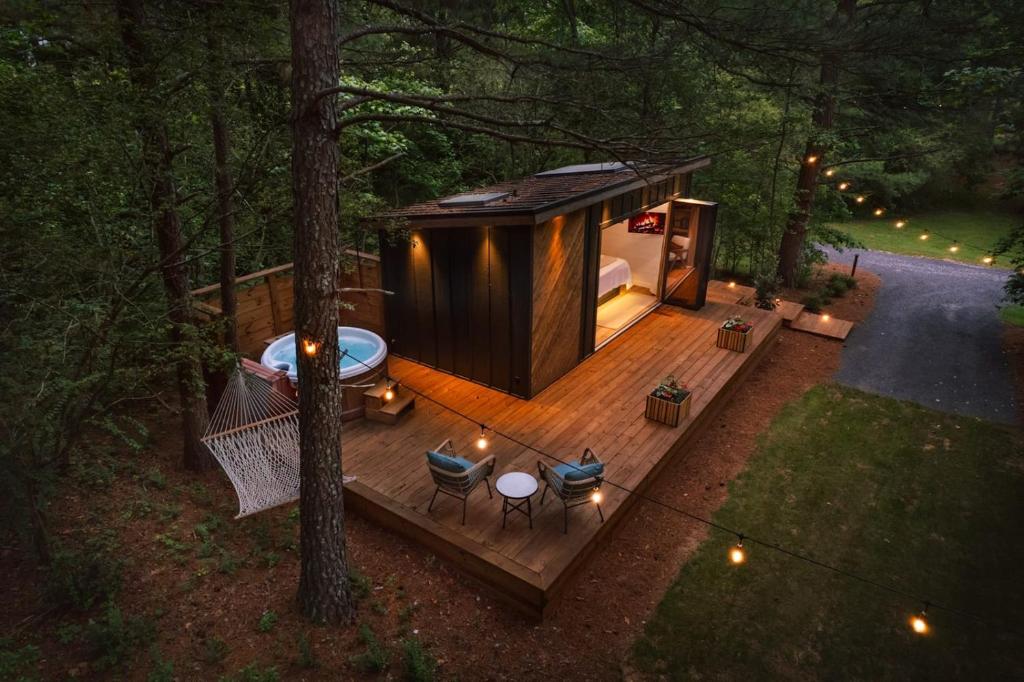 an overhead view of a tiny house in the woods at Glamping cottage with glass front and hot tub! in Guntersville