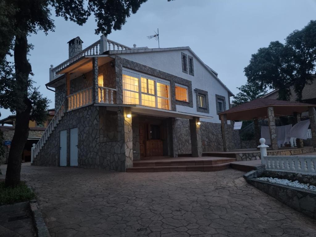 a large house with a balcony on the side of it at VUT EL Mogollón in Guadalajara