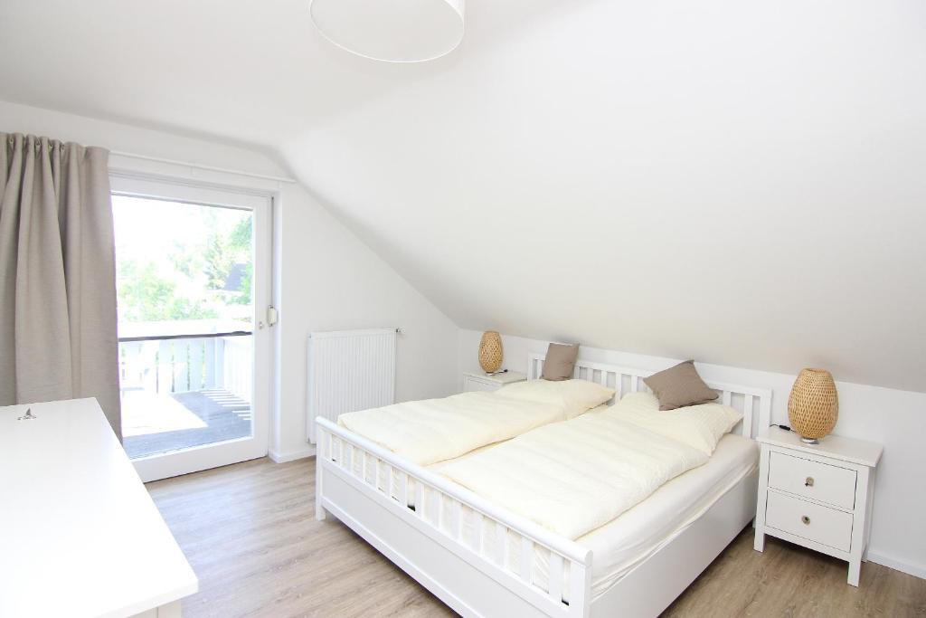 Postel nebo postele na pokoji v ubytování Haus Badezeit