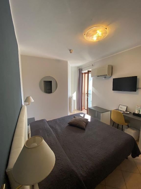Postel nebo postele na pokoji v ubytování Hotel Romagna