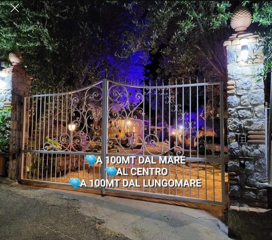 a front gate with a sign on it at DONNA FILOMENA Residence in Marina di Camerota