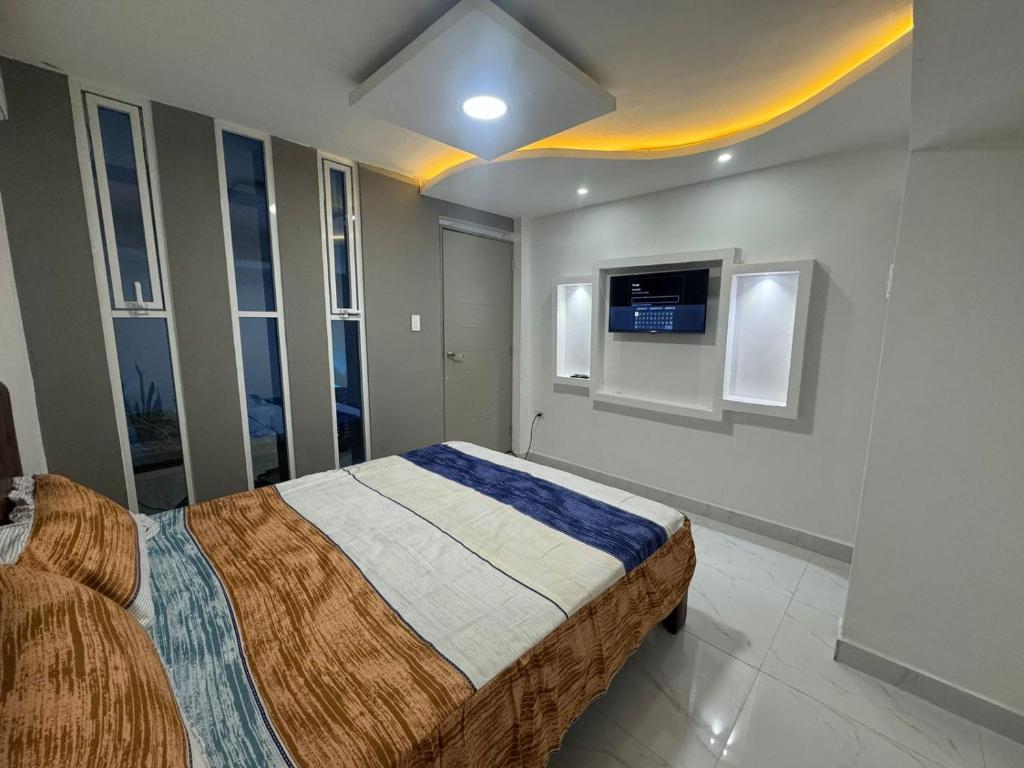 Postel nebo postele na pokoji v ubytování Hostal Las Orquideas 2