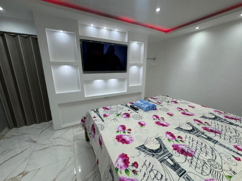Postel nebo postele na pokoji v ubytování Hostal Las Orquideas 2