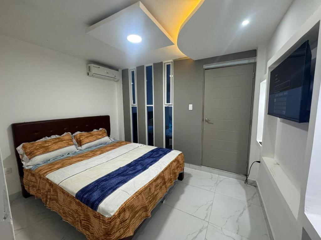 Postel nebo postele na pokoji v ubytování Hostal Las Orquideas 2