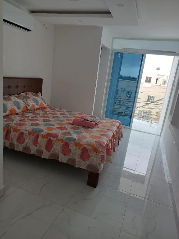 Postel nebo postele na pokoji v ubytování Hostal Las Orquideas 2