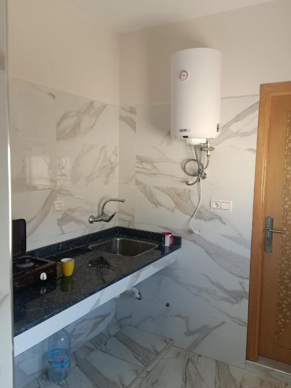 Kuchyň nebo kuchyňský kout v ubytování studio équipé