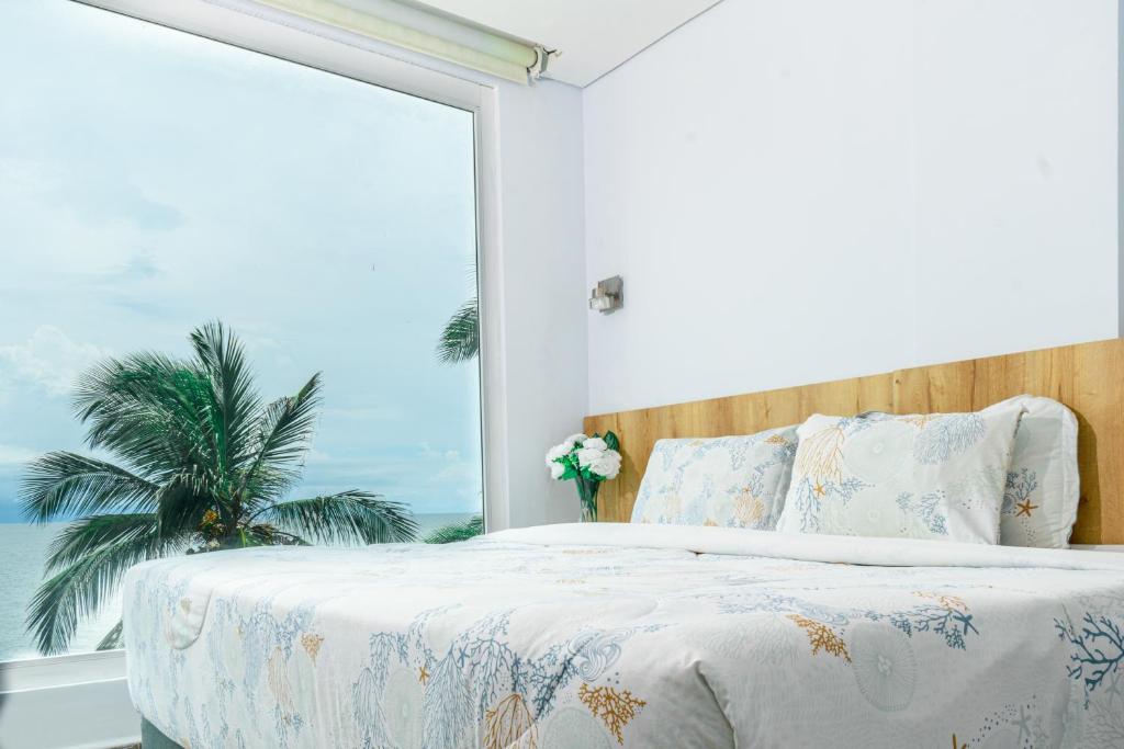 Postel nebo postele na pokoji v ubytování Hotel Caribbean Cartagena