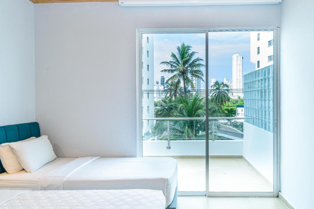Postel nebo postele na pokoji v ubytování Hotel Caribbean Cartagena