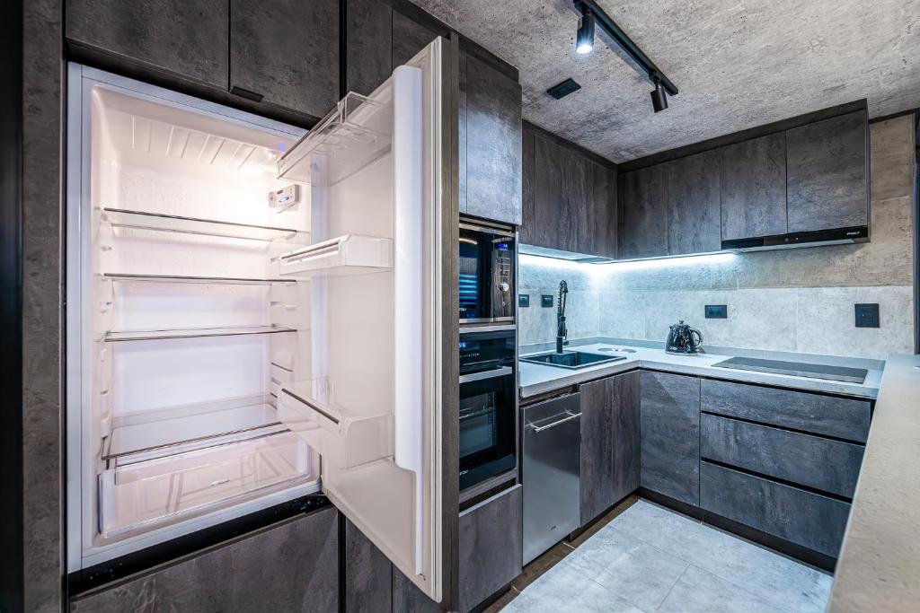 Kuchyň nebo kuchyňský kout v ubytování Design Tech Comfort & Location