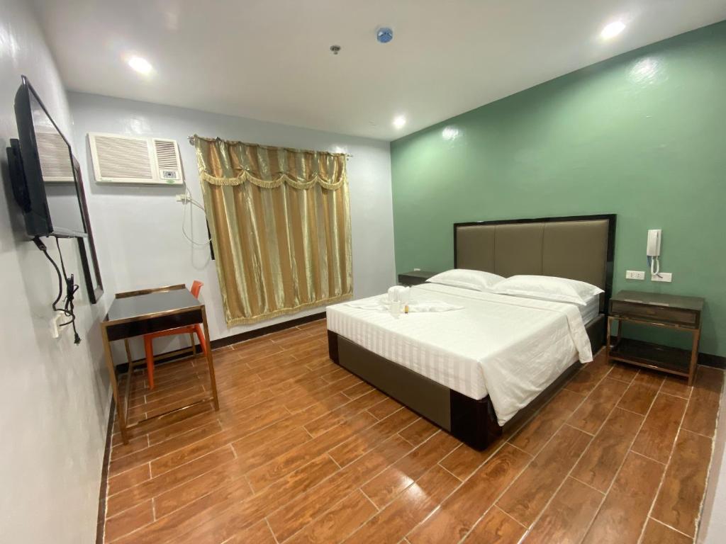 Postel nebo postele na pokoji v ubytování Asia Jem Hotel - BAYAWAN