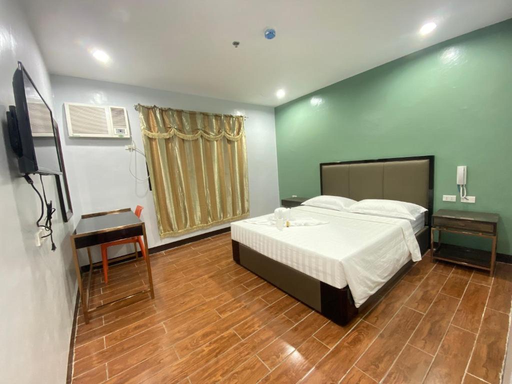 Postel nebo postele na pokoji v ubytování Asia Jem Hotel - BAYAWAN