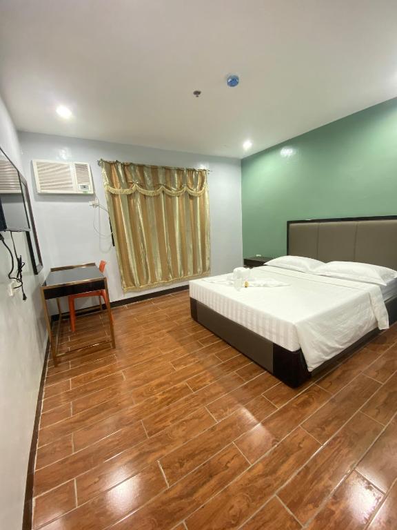 Postel nebo postele na pokoji v ubytování Asia Jem Hotel - BAYAWAN