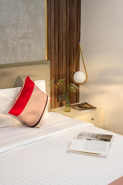Postel nebo postele na pokoji v ubytování Acnos Hotel